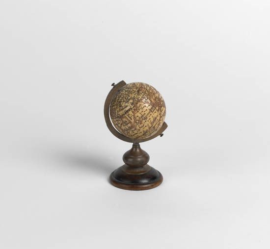 (GLOBE.) Fine miniature ivory terrestrial globe.